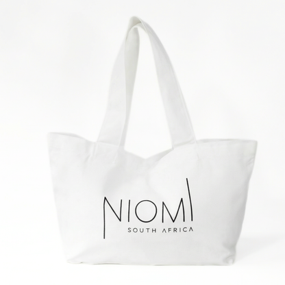 NIOMI large white tote bag with black NIOMI logo, stylish everyday carry bag for beach, gym, and shopping
