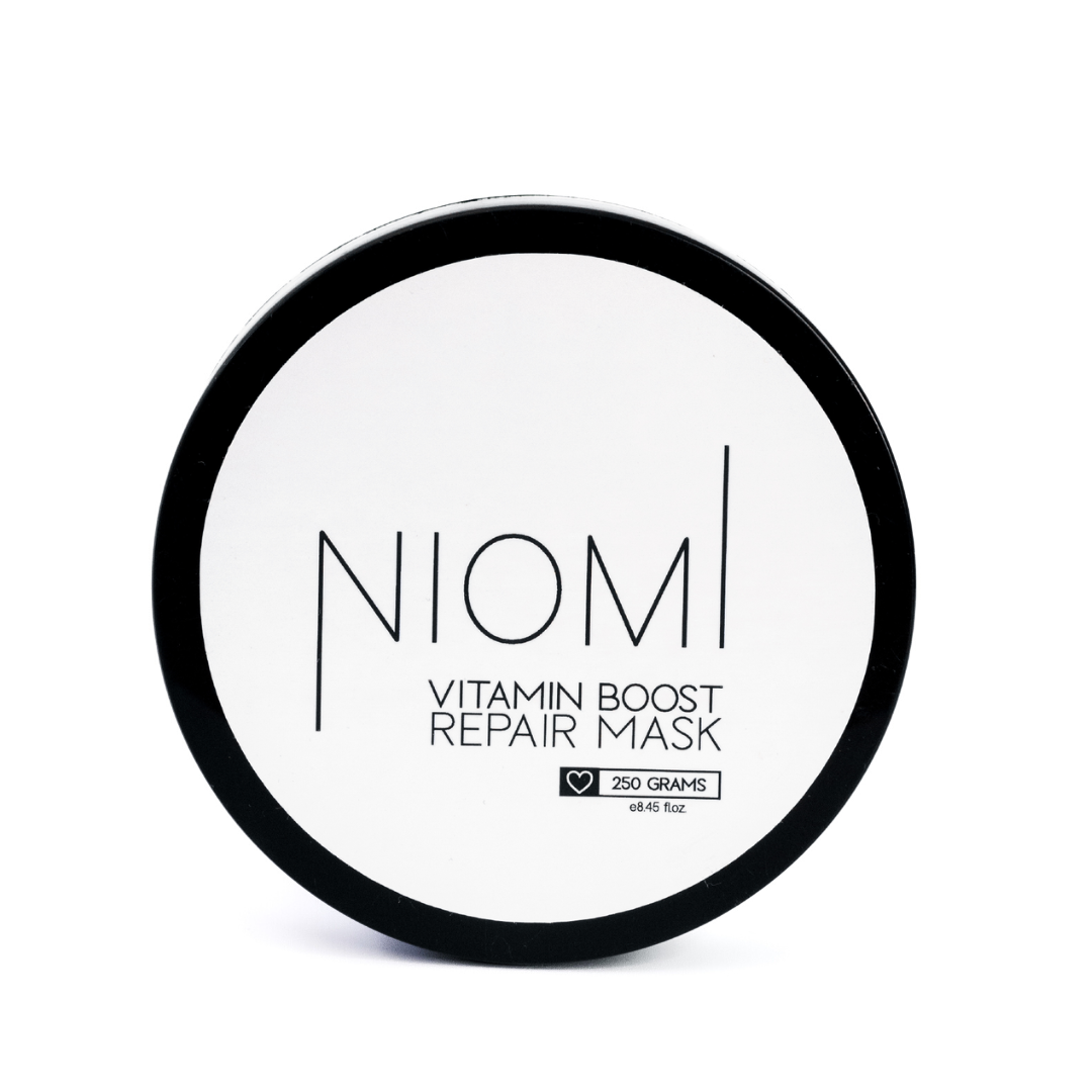 NIOMI Vitamin Boost Repair Mask packaging with product visible inside. 