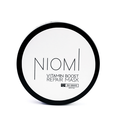 NIOMI Vitamin Boost Repair Mask packaging with product visible inside. 