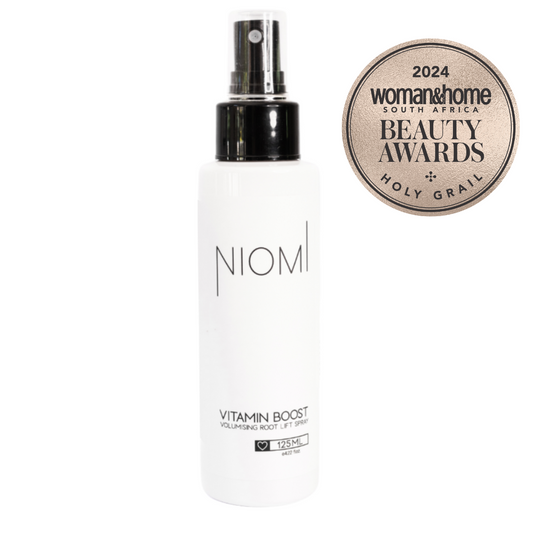 NIOMI Vitamin Boost Volumising Root Lift Spray bottle with a '2024 woman&home Beauty Awards Holy Grail' badge.